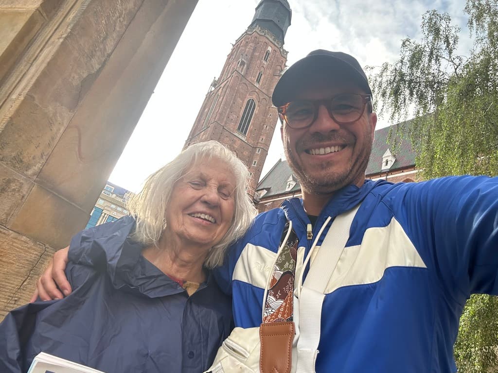 Christian and his grandmother smiling together in Poland