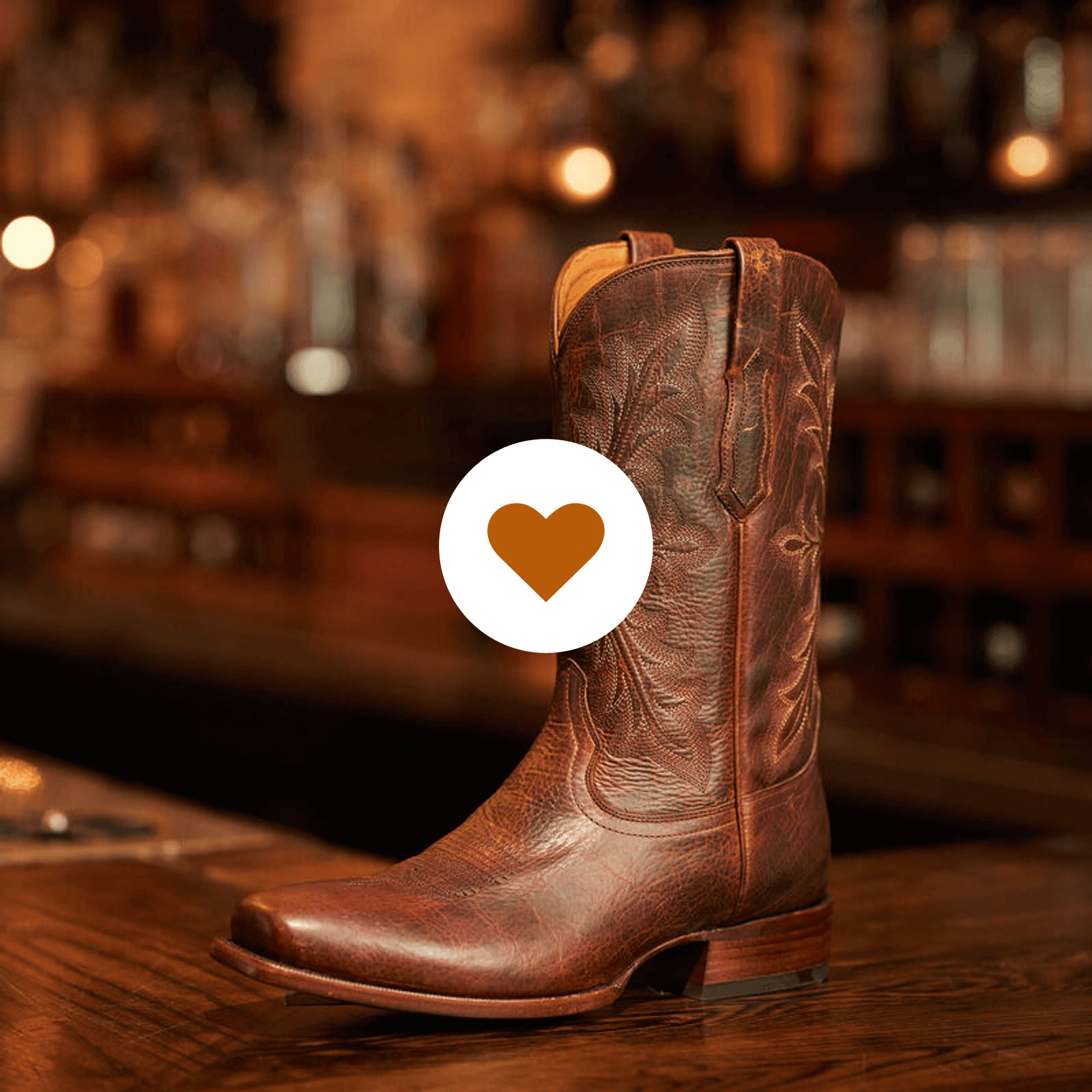Ariat western boot with a filled orange Save for Later heart